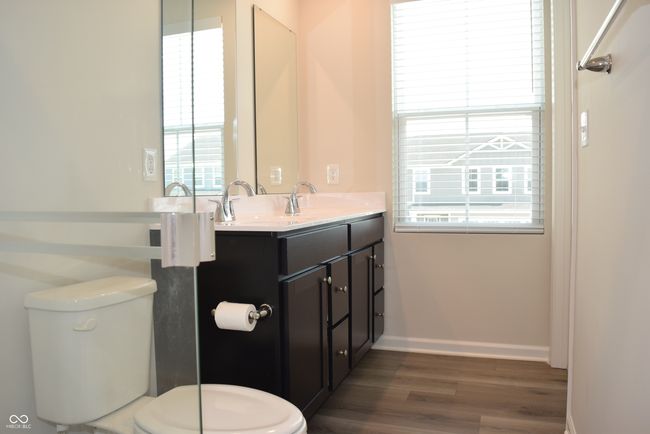 primary bathroom with two sinks and window for natural lighting | Image 29