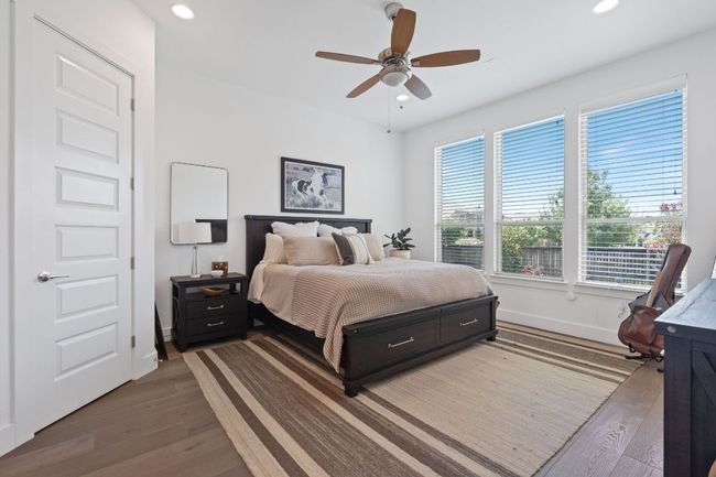 Bedroom with wood finished floors, recessed lighting, and ceiling fan | Image 27