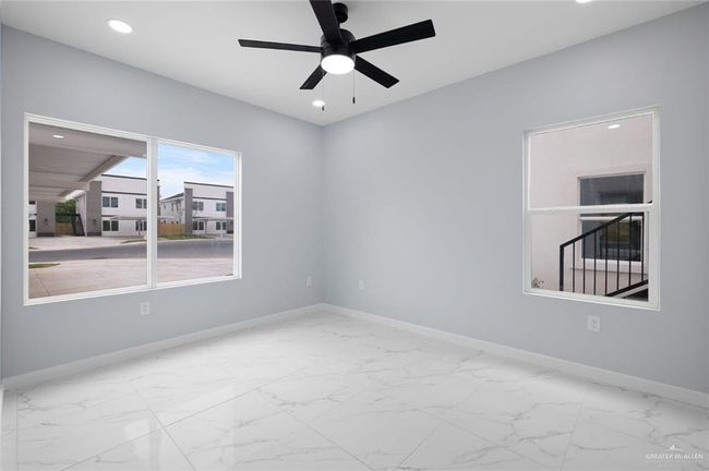 Unfurnished room with baseboards, recessed lighting, a ceiling fan, and marble finish floors | Image 15