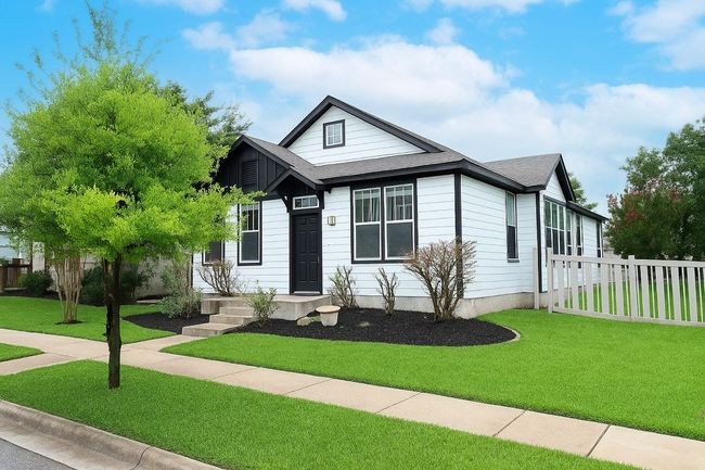 This charming single-story 3BD/2BA home shines with thoughtful upgrades and cheerful curb appeal framed by mature landscaping and a vibrant exterior. | Image 7
