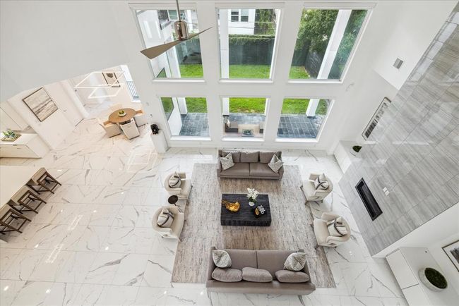 From this vantage point, you can enjoy panoramic views of the living areas below, creating a seamless flow and enhancing the overall openness of the home's layout. | Image 29
