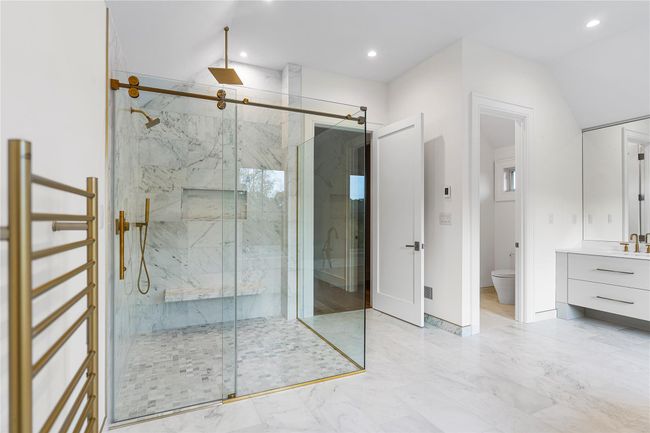 Full bathroom with a marble finish shower, toilet, recessed lighting, marble finish flooring, and vanity | Image 36