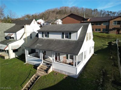 View of front of house featuring a deck and a front lawn | Image 3