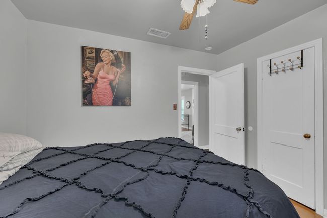 Bedroom featuring ceiling fan | Image 15