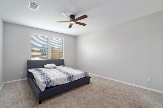 Carpeted bedroom with baseboards and a ceiling​​‌​​​​‌​​‌‌​‌‌​​​‌‌​​‌‌​‌​​​​​‌ fan | Image 11