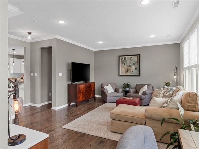 A cozy workspace is tucked into the corner, providing added versatility without compromising flow. | Image 14