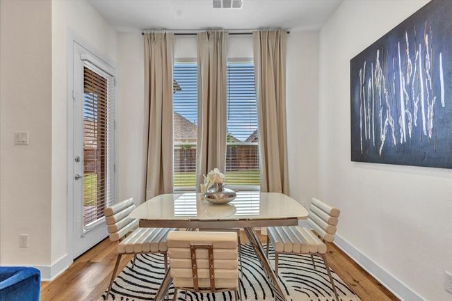 Breakfast nook with the view of the backyard. | Image 13