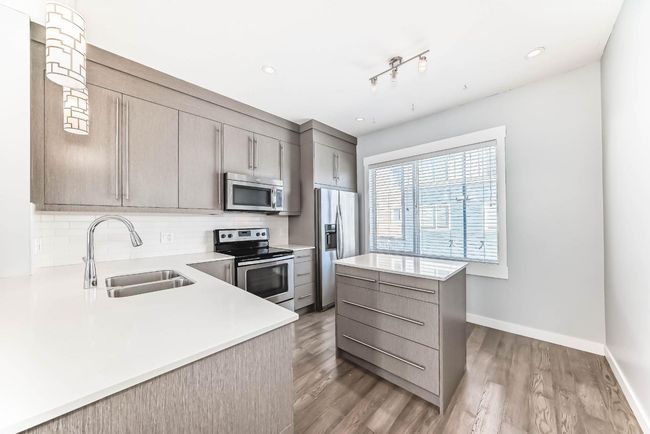 52 - 111 Rainbow Falls Gate, Townhouse with 2 bedrooms, 3 bathrooms and 2 parking in Chestermere AB | Image 8