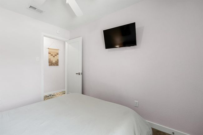 Bedroom with ceiling fan and baseboards | Image 20