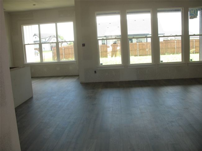 Spare room featuring wood finished floors | Image 7