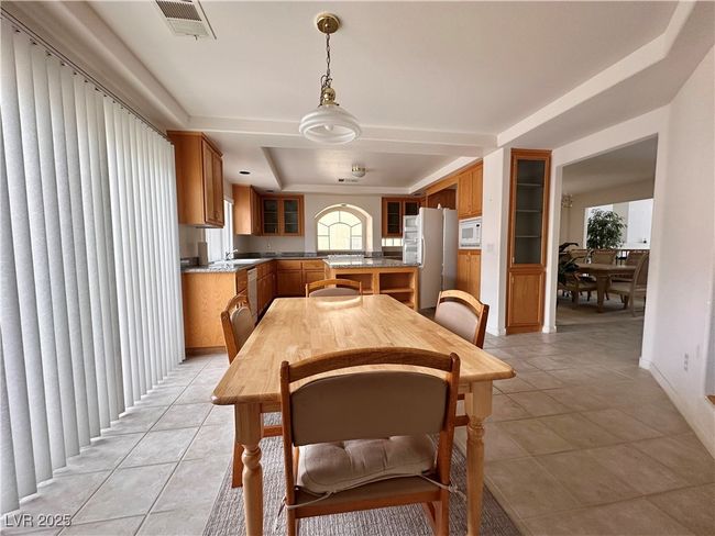 Dining area featuring light tile patterned flooring | Image 5