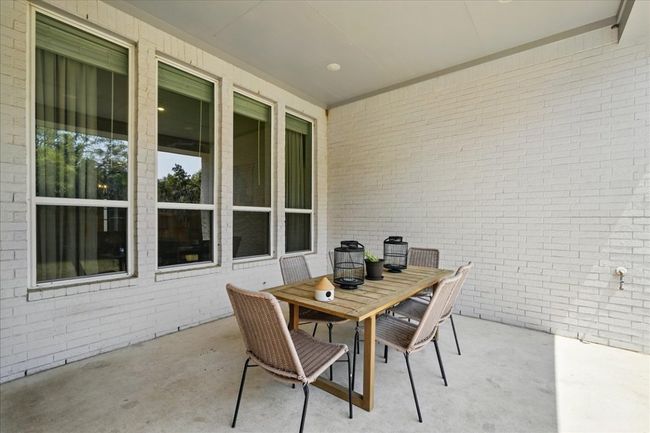 View of patio featuring outdoor dining space | Image 32