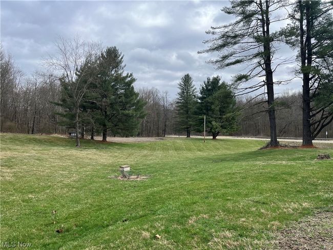 View of property's community with a lawn | Image 4
