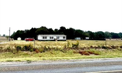 View of yard with a rural view | Image 1