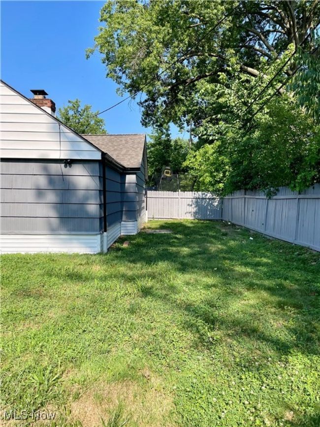 View of fenced backyard | Image 5