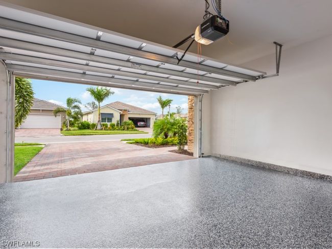 The Garage Floor has been upgraded with 1/4” Full Chip Polyurea (more durable than Epoxy) Coating System with a transferrable 20-year warranty | Image 24