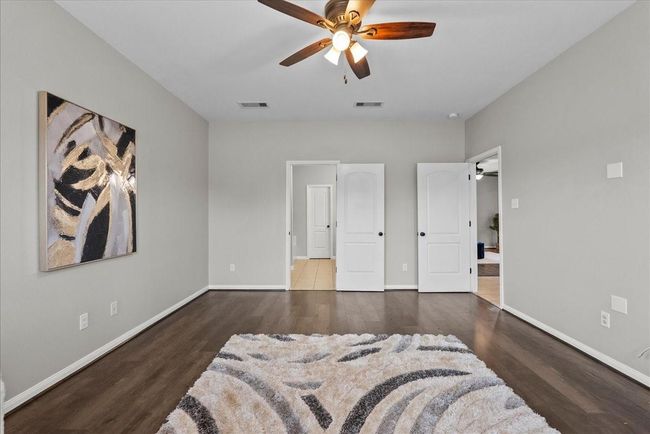 Start and end your day in style in this luxurious and comfortable bedroom haven. | Image 16