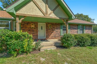 Property entrance with covered porch and a yard | Image 2