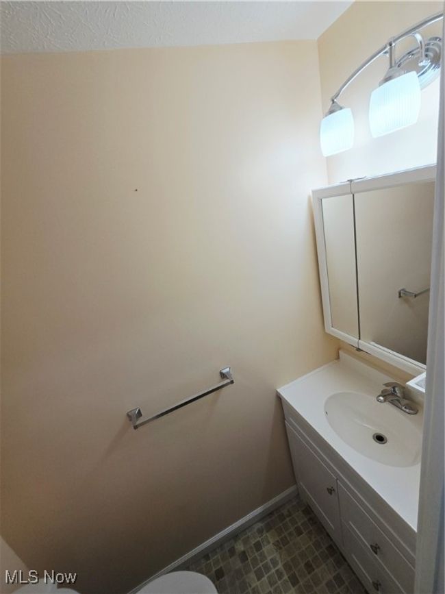 Half bathroom with vanity and toilet | Image 15