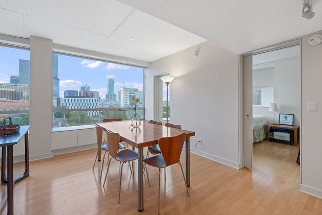 Dining area and "primary" bedroom is behind. | Image 11