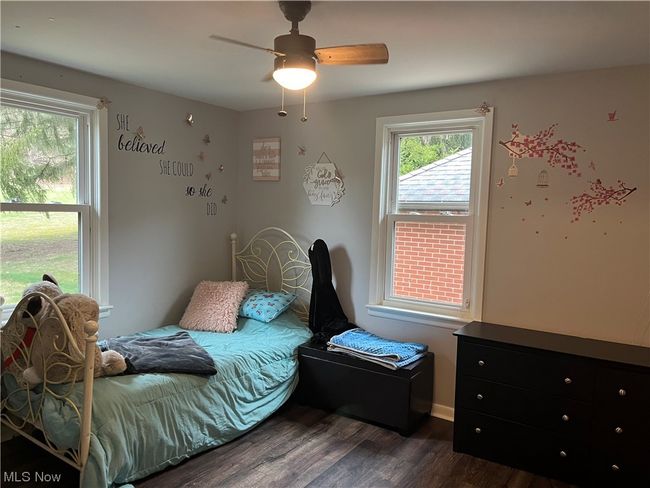 Bedroom featuring dark hardwood / wood-style flooring and ceiling fan | Image 19