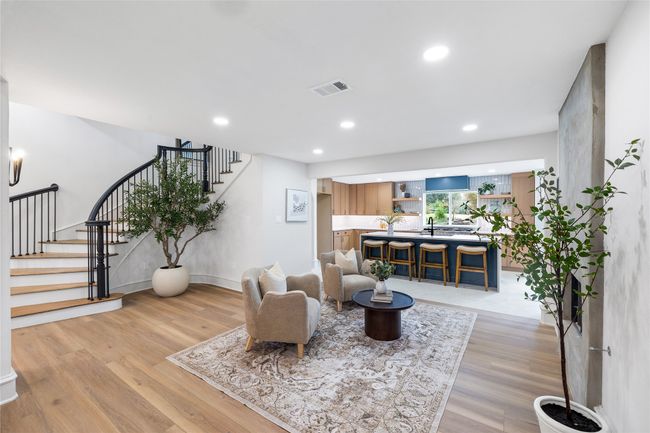 Living room featuring stairway, light wood finished floors, and recessed lighting | Image 11