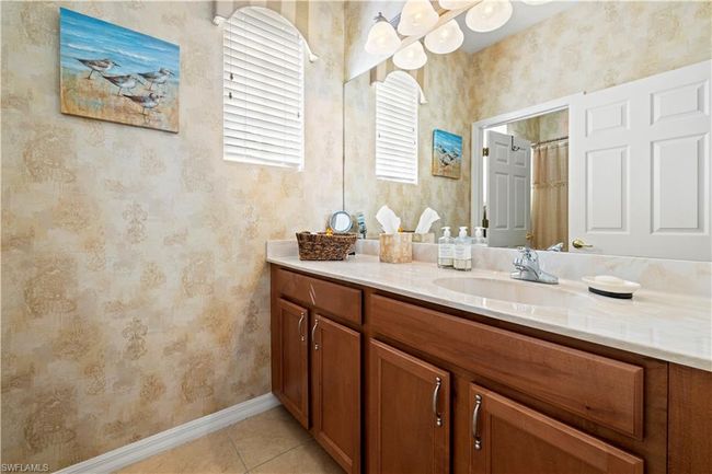 Bathroom #2 with visible vents, tile patterned flooring, shower / bath combination with curtain, and toilet | Image 10