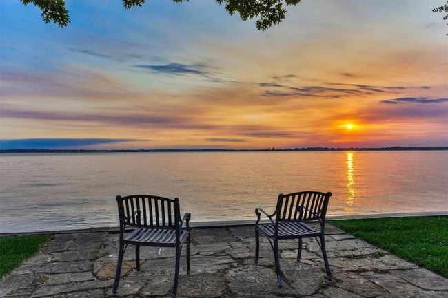Enjoy this peaceful view every evening from your own backyard. Future plans for this area were thoughtfully considered during the remodel and the main electrical panel is plumbed to an exterior electrical box for any future wiring to the landscape or bulkhead area. | Image 46