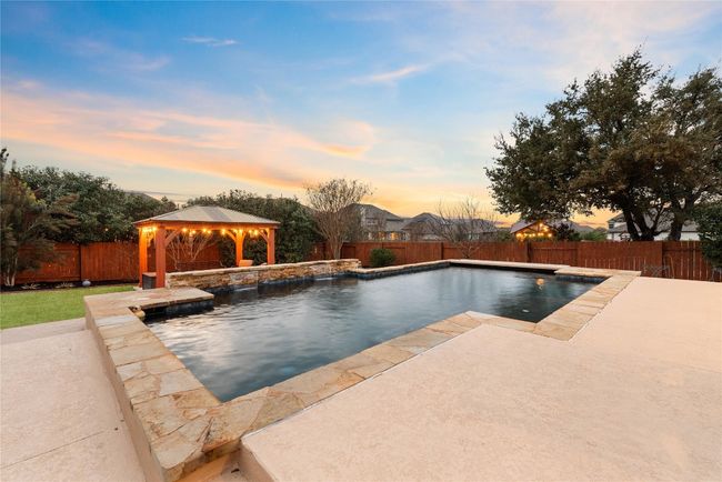 Backyard Oasis with Sparkling Pool, Pergola, and Outdoor Kitchen | Image 30