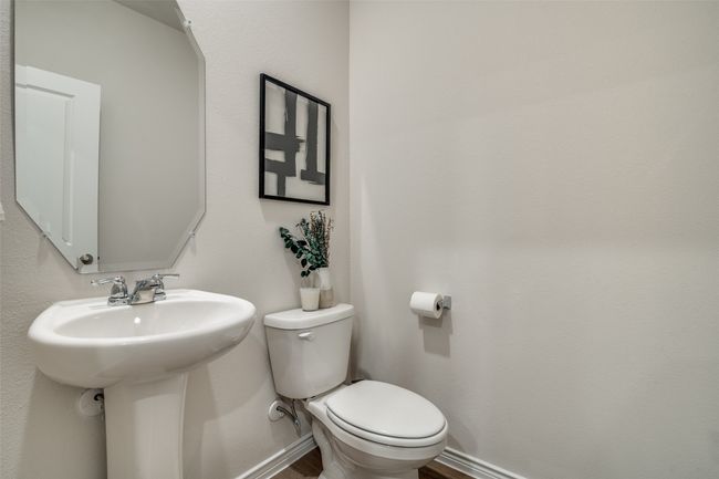 Bathroom featuring toilet and wood finished floors | Image 15
