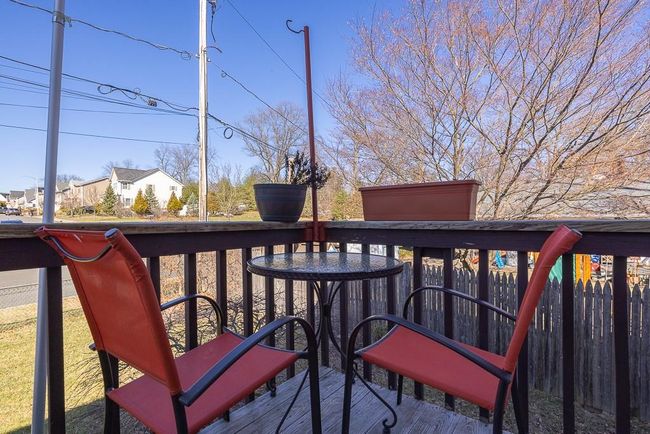 View of wooden balcony/deck at the front entrance of home | Image 17