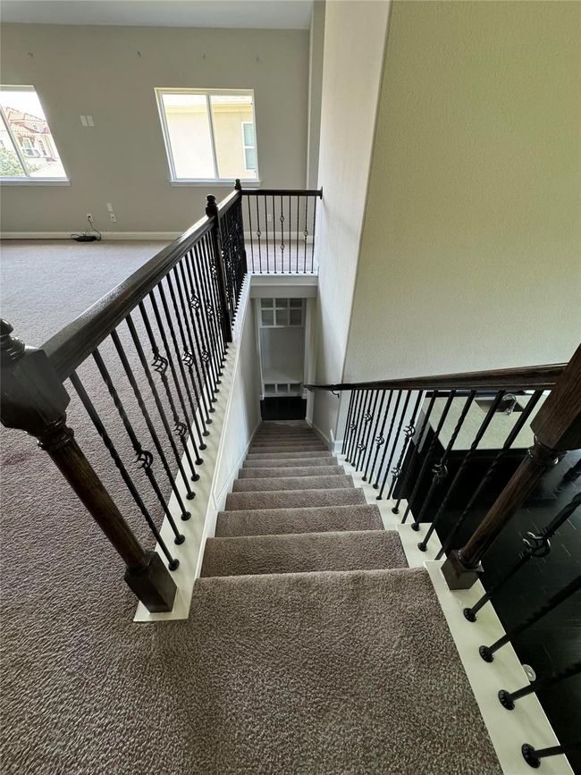Stairs featuring carpet floors and baseboards | Image 24