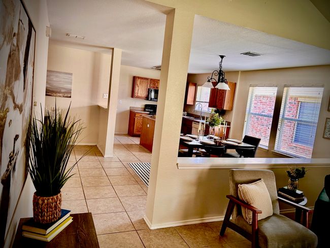 Dining space featuring light tile patterned floors | Image 12