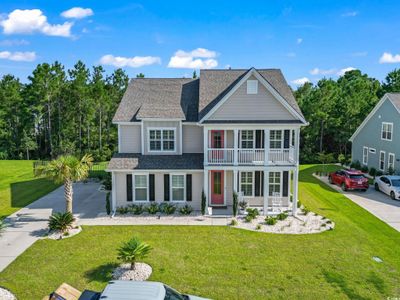 View of front of house with a balcony and a front yard | Image 2