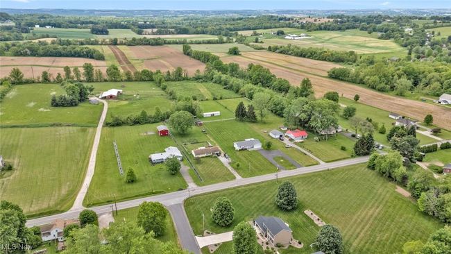 Aerial view of property's location featuring rural landscape and large plots for crops | Image 38