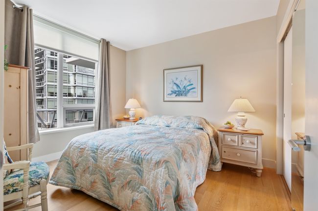 Bedroom featuring baseboards, wood finished floors, and a closet | Image 11