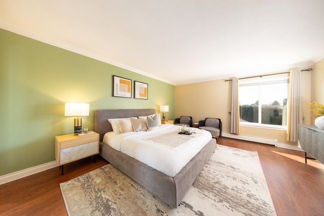 Bedroom with baseboards, ornamental molding, wood finished floors, and a baseboard heating unit | Image 29