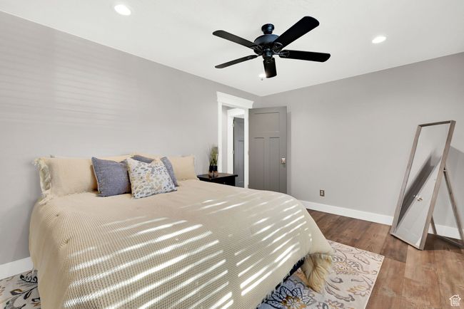 Bedroom featuring ceiling fan and hardwood / wood-style floors | Image 18