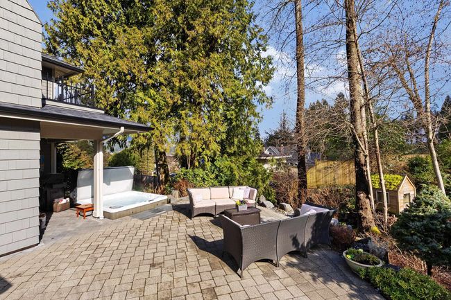 View of patio with outdoor lounge area, a balcony, and a covered hot tub | Image 27