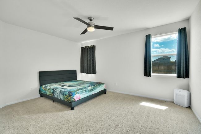 Carpeted bedroom with baseboards and ceiling fan | Image 15