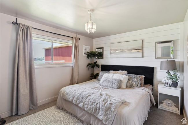 Bedroom featuring carpet flooring and a chandelier | Image 12