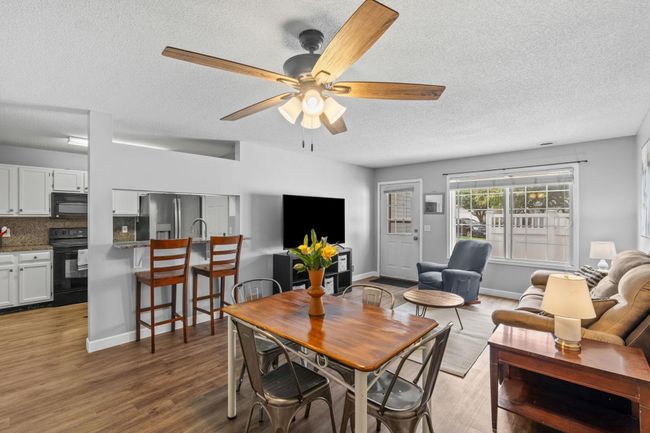 Open-concept layout connects the living, dining, and kitchen areas, perfect for gatherings. | Image 8