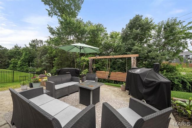 View of patio / terrace featuring an outdoor living space and area for grilling | Image 44