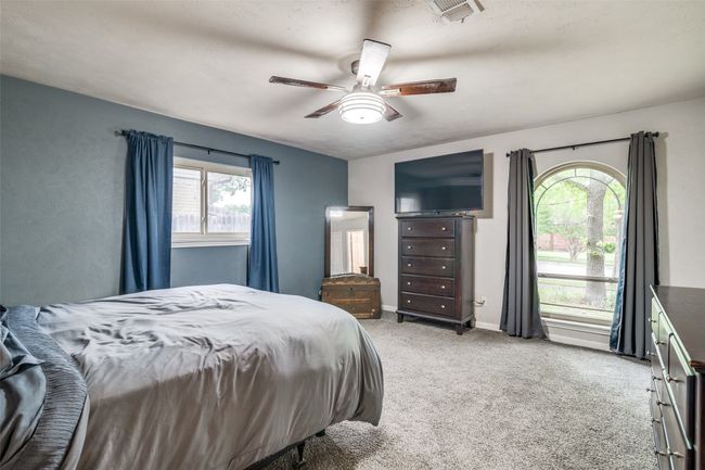 Carpeted bedroom featuring a ceiling fan | Image 18
