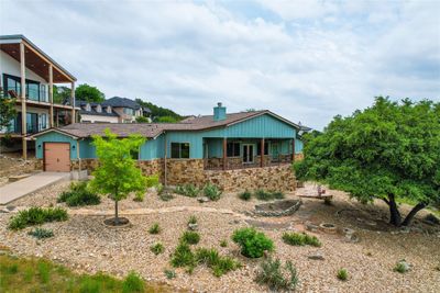 There is a two-car garage with a storage closet plus a separate golf cart garage. | Image 3