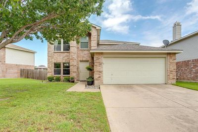 View of front of house with a garage and a front yard | Image 2