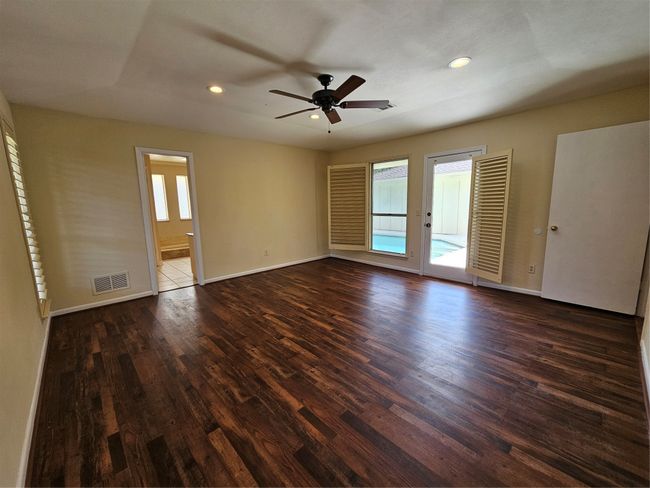 Unfurnished room featuring wood finished floors, recessed lighting, and ceiling fan | Image 11
