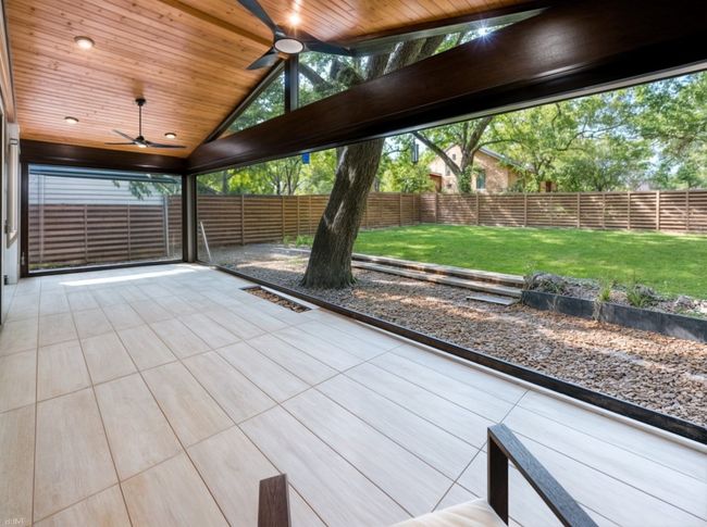 Unfurnished sunroom featuring ceiling fan | Image 29