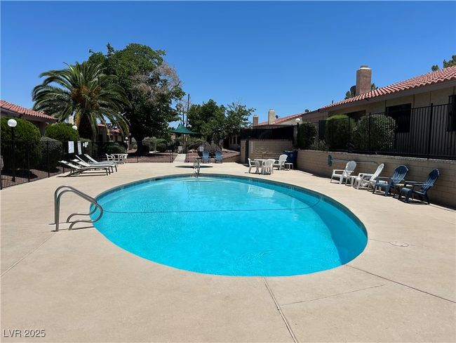 Community pool with a patio area | Image 42