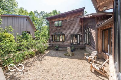 The courtyard is a fantastic spot to enjoy the sunshine in the center of your wooded retreat. | Image 3